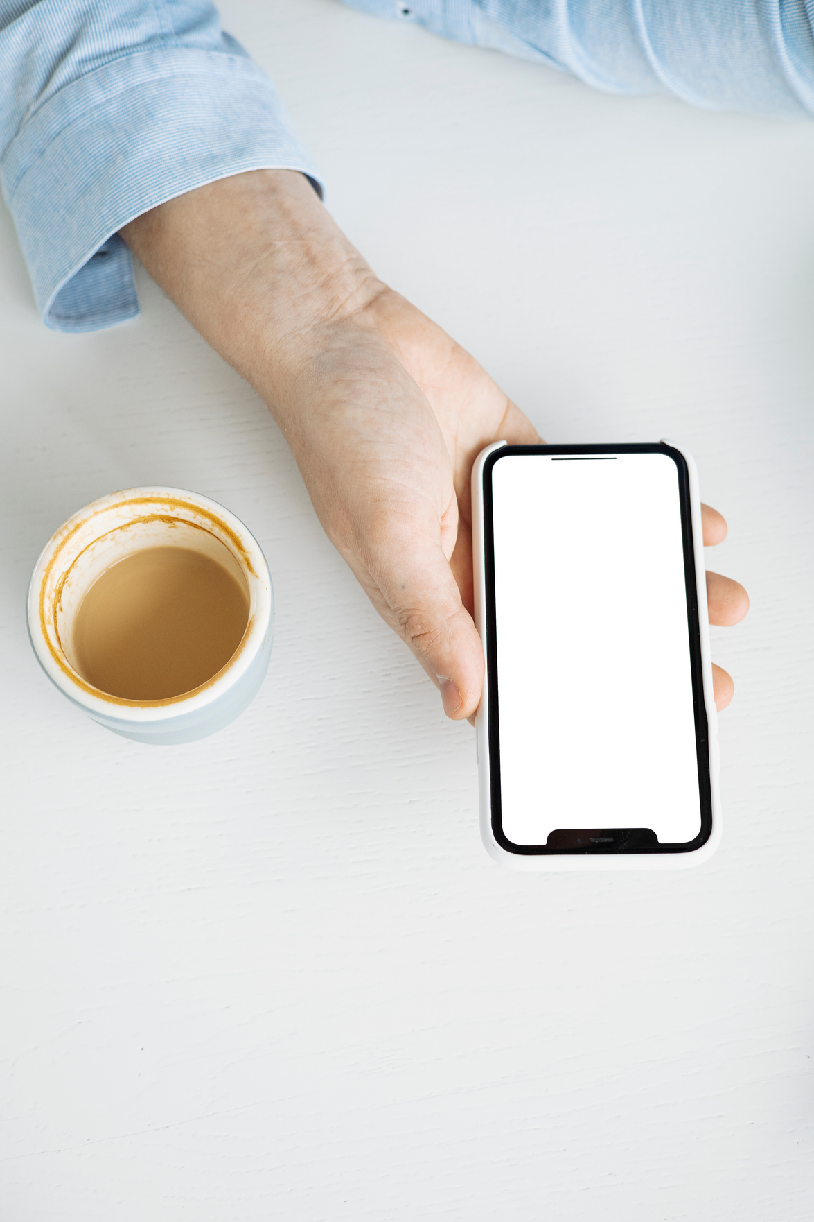 Person Holding White Mobile Phone